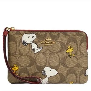 Coach x Peanuts Corner Zip Wristlet In Signature Canvas With Snoopy & Woodstock